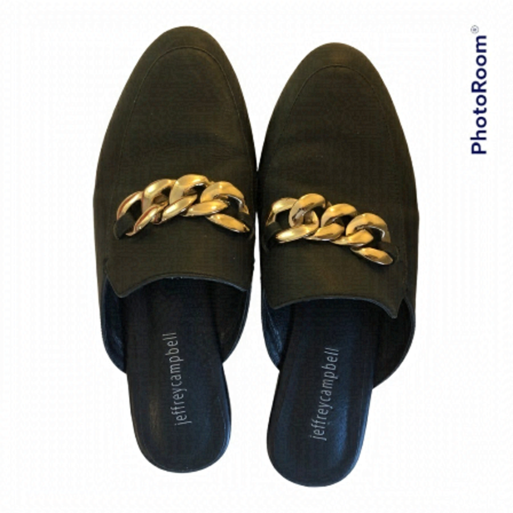 Jeffrey Campbell black mule slides with chunky gold chain detail.